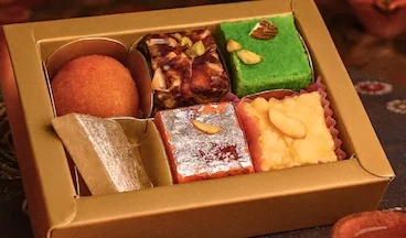 Royal Mithai Delight Selection gold gift box filled with six assorted sweets